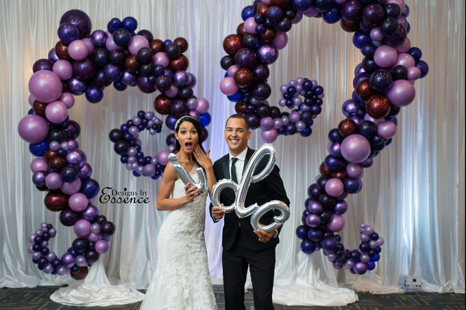 Purple and blue custom balloon arch for wedding, including bride and groom saying I do